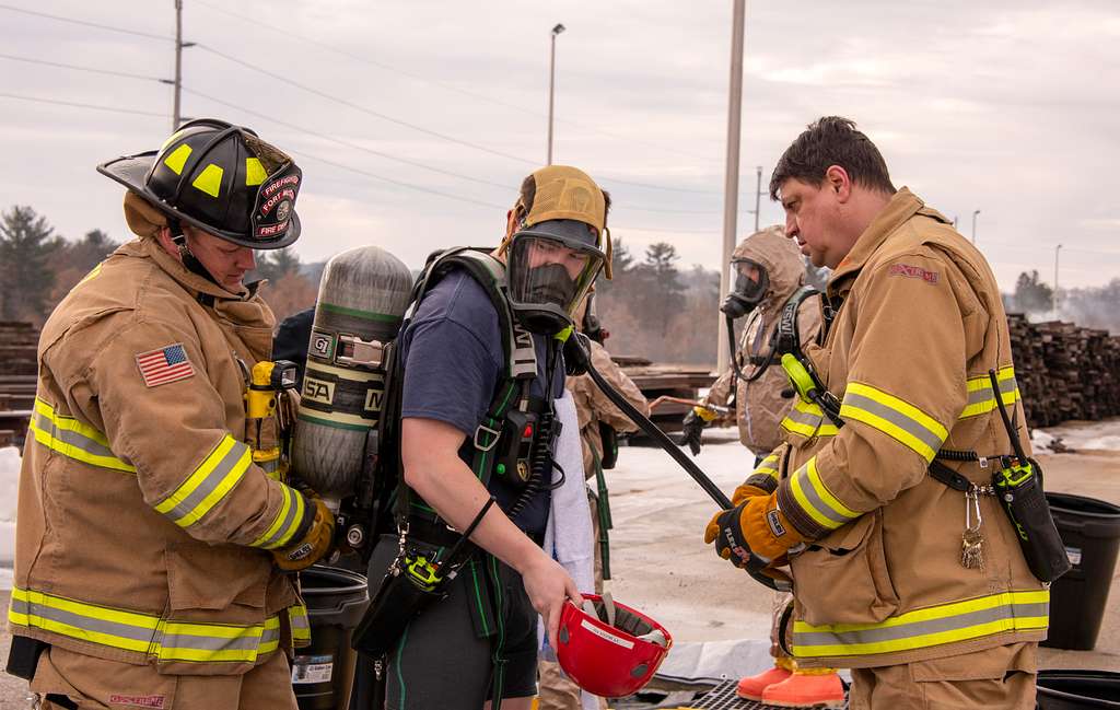 Firefighters working alongside the Directorate of Emergency Services during an incident response drill in 2019.