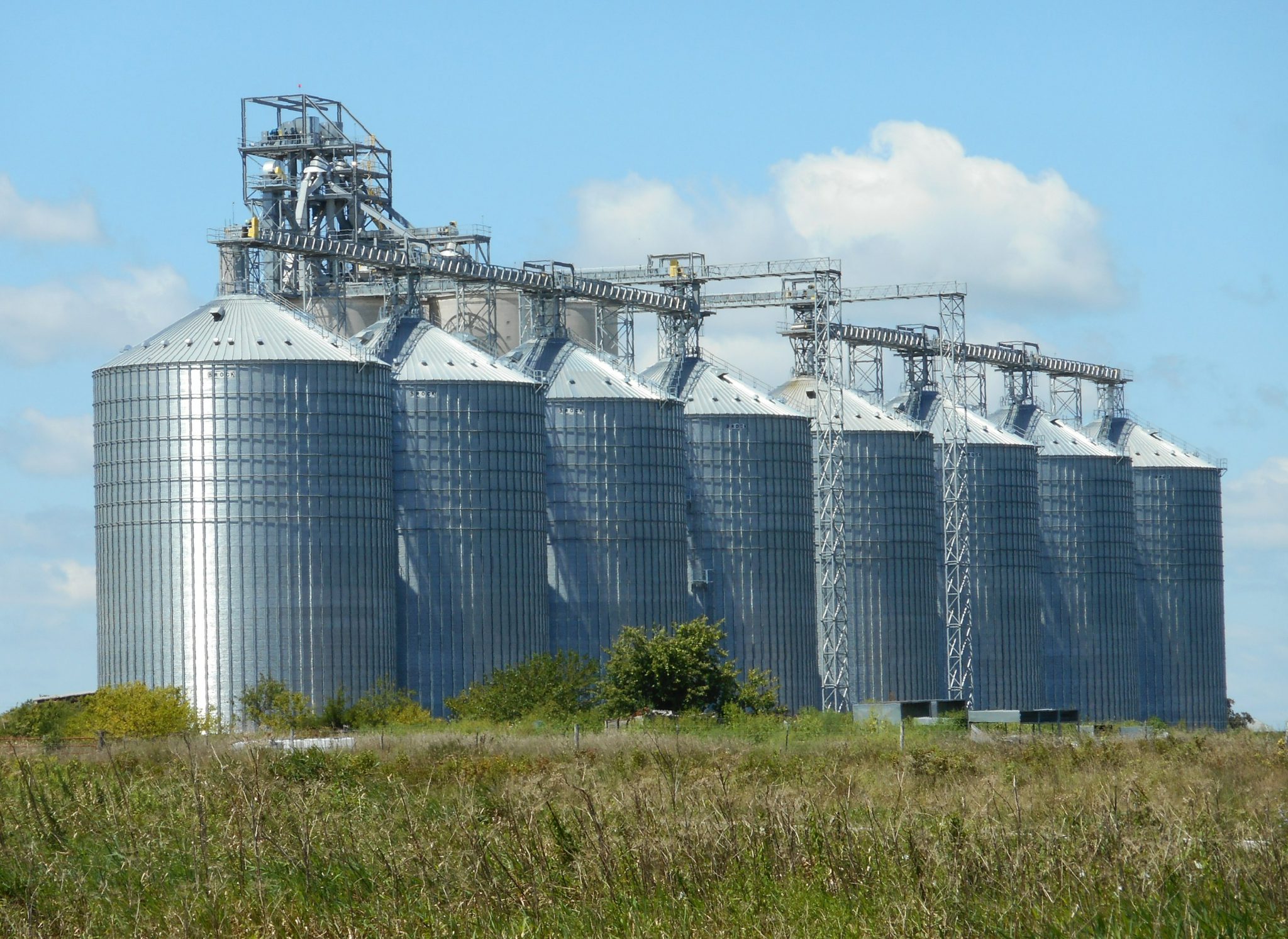 Grain silos on a field. 