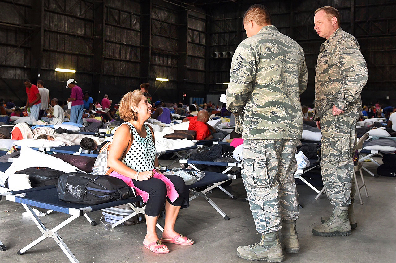 Residents stay at a makeshift evacuation shelter. 