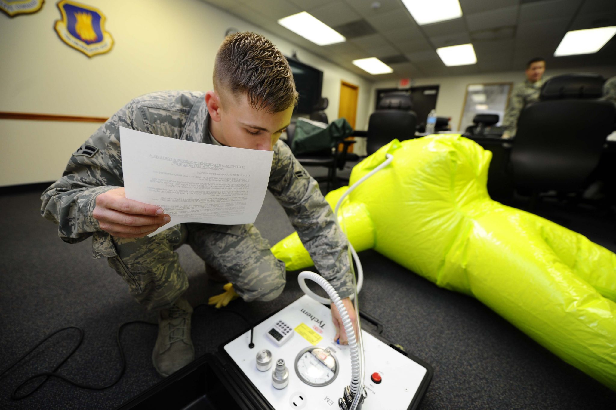 A member of the 22nd Civil Engineer Squadron checks equipment as part of their emergency management preparatory work.