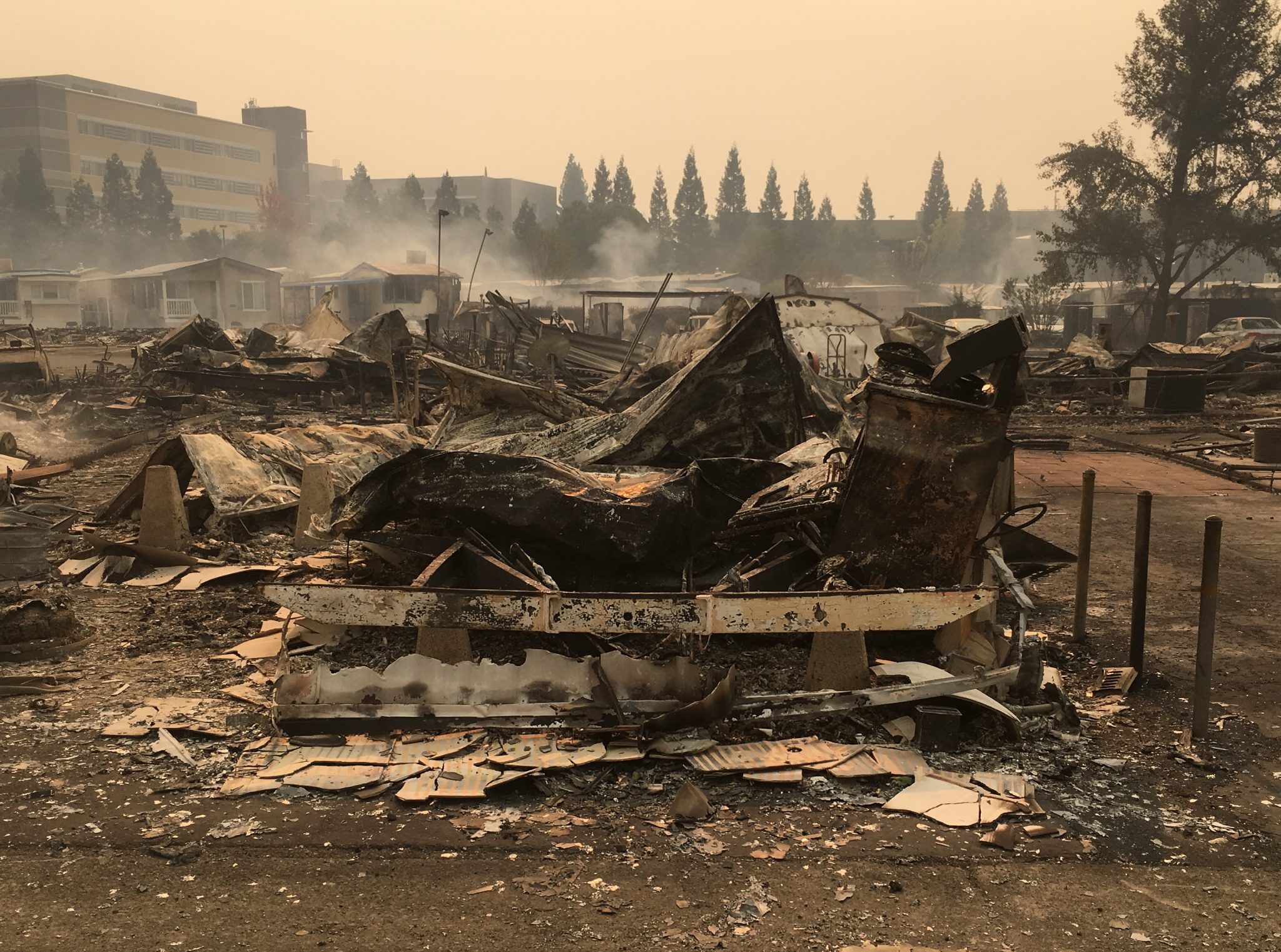 The remains of a mobile home in Santa Rosa smolder during the Tubbs Fire.